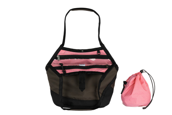 The Swift in Ursa (greyish-brown) Ballistic with a Sakura (pale pink with white grid) interior and Medium Yarn Stuff Sack